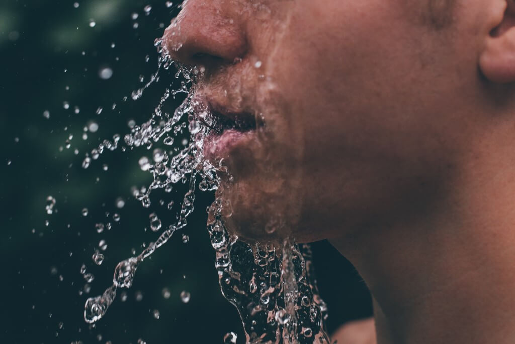 a man with water on his face